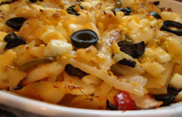 How to make Portuguese style cod with onions, peppers and black olives.