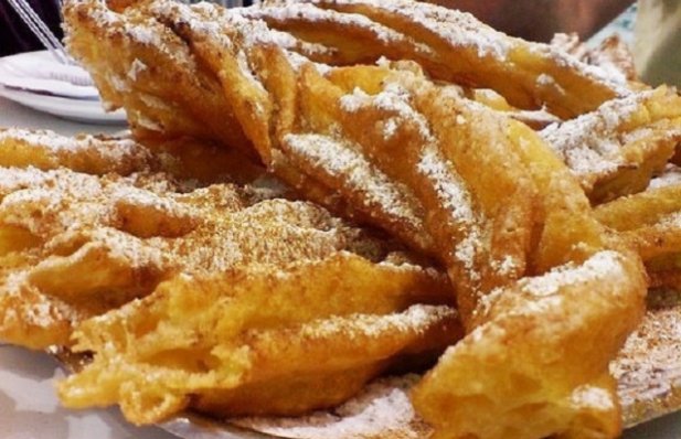 Farturas is a traditional Portuguese dessert that is a combination of funnel cake and churros and is very popular in Portugal.