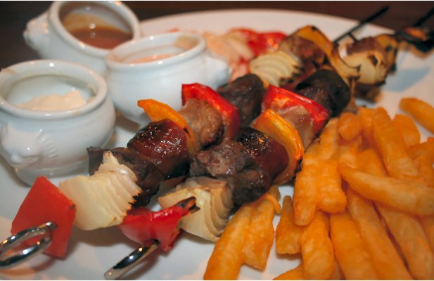 This Portuguese style kebabs recipe makes amazing grilled skewers of beef, pork and chouriço with peppers and onions, served with piri piri dipping sauce.