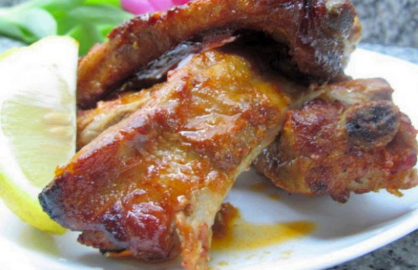 Serve these amazing Marinated Portuguese roasted pork ribs (costeletas de porco assadas) with some rice and a good wine.