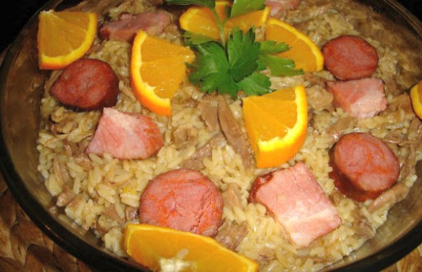 This is a version of the classic Portuguese duck rice (arroz de pato), which uses the fragrant, fatty poaching stock from the duck to cook the rice.
